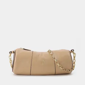 Manu Atelier  Cylinder Bag in Beige Leather